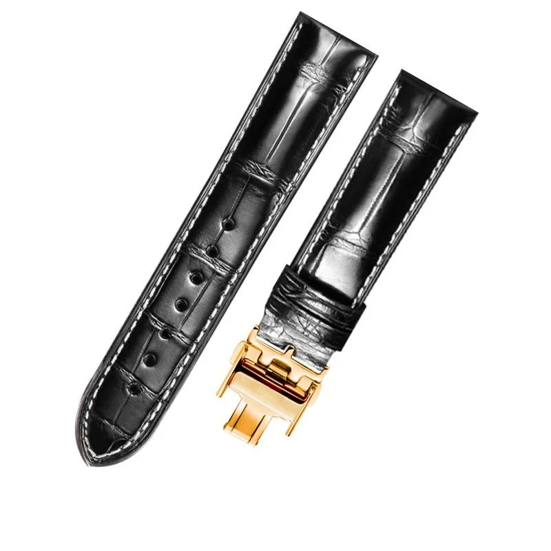 WatchesMate black alligator-textured leather strap for Longines with gold deployant clasp.