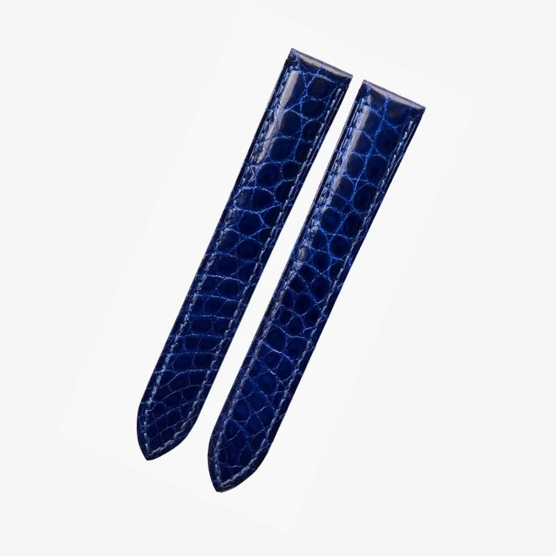 Bright blue alligator-textured leather watch strap by WatchesMate, compatible with Cartier Tank and similar watches