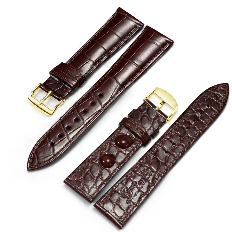 Brown dual-sided alligator-textured leather strap with gold pin buckle.
