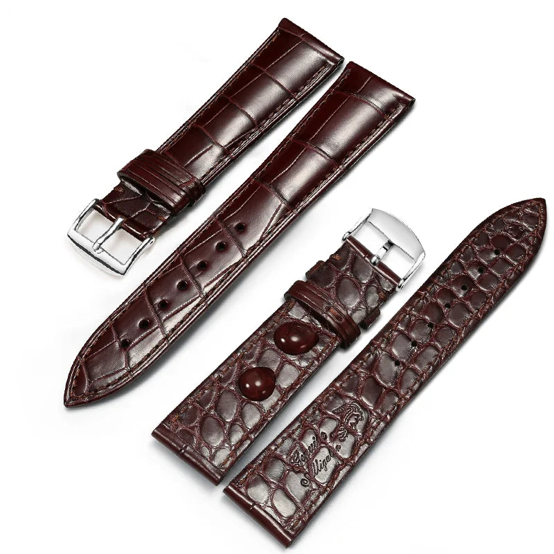 Brown dual-sided alligator-textured leather strap with silver pin buckle.