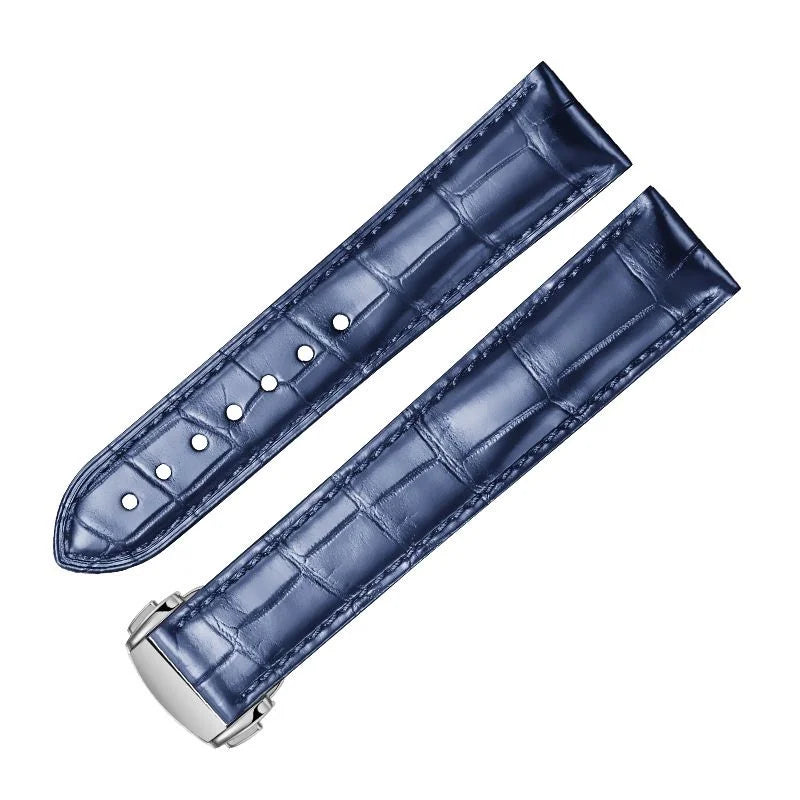 Dark blue alligator-textured leather strap for Omega with silver deployant clasp, featuring durable hand‑stitched craftsmanship.