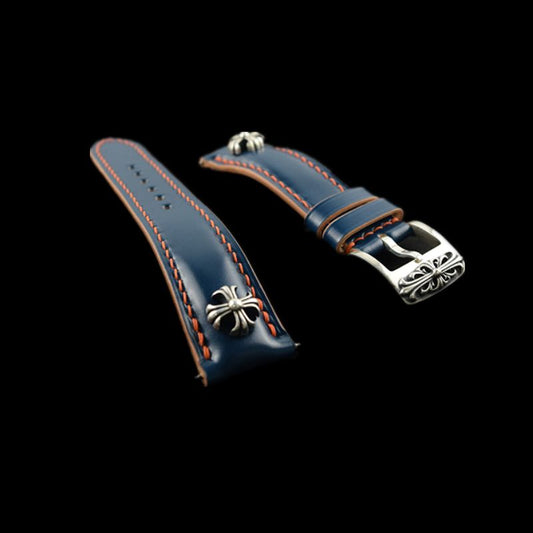 Handcrafted blue Shell Cordovan leather watch strap featuring cross studs and sterling silver accents, designed for premium watches