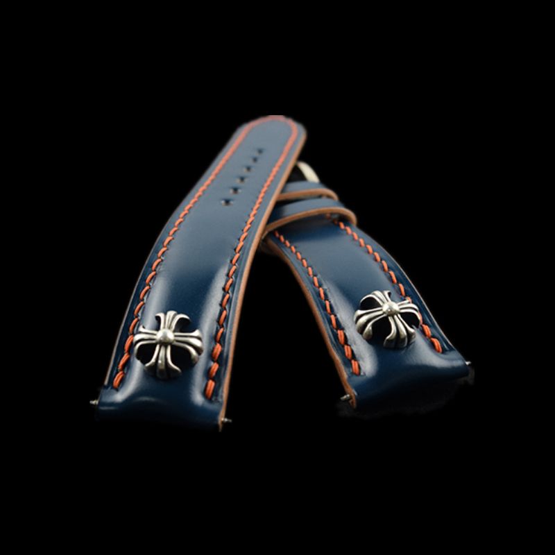 Handcrafted Japanese Shell Cordovan leather watch strap featuring cross studs and sterling silver accents, designed for premium watches
