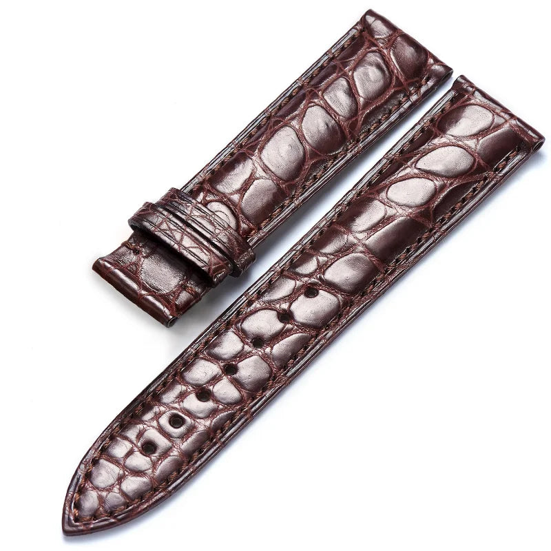 Brown alligator‑textured leather strap with water‑resistant cowhide backing, available in 12–24 mm widths.