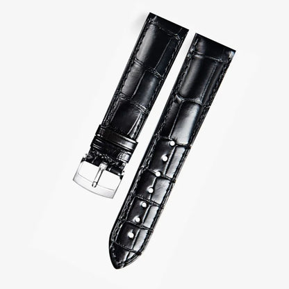 Black alligator-textured leather watch band compatible with Omega dress watches, featuring a polished silver pin buckle for a refined and timeless look