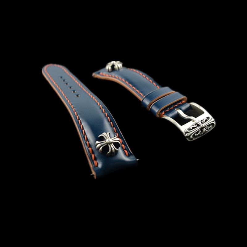 Handcrafted blue Shell Cordovan leather watch strap featuring cross studs and sterling silver accents, designed for premium watches