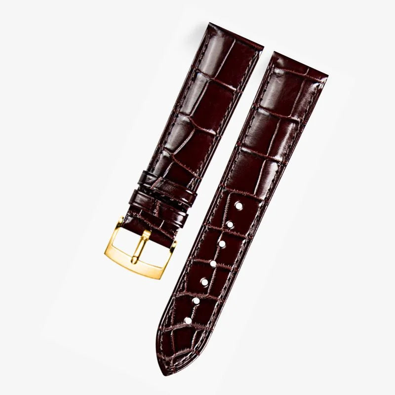 Brown alligator-textured leather watch band compatible with Omega dress watches, featuring a polished gold pin buckle for a refined and timeless look