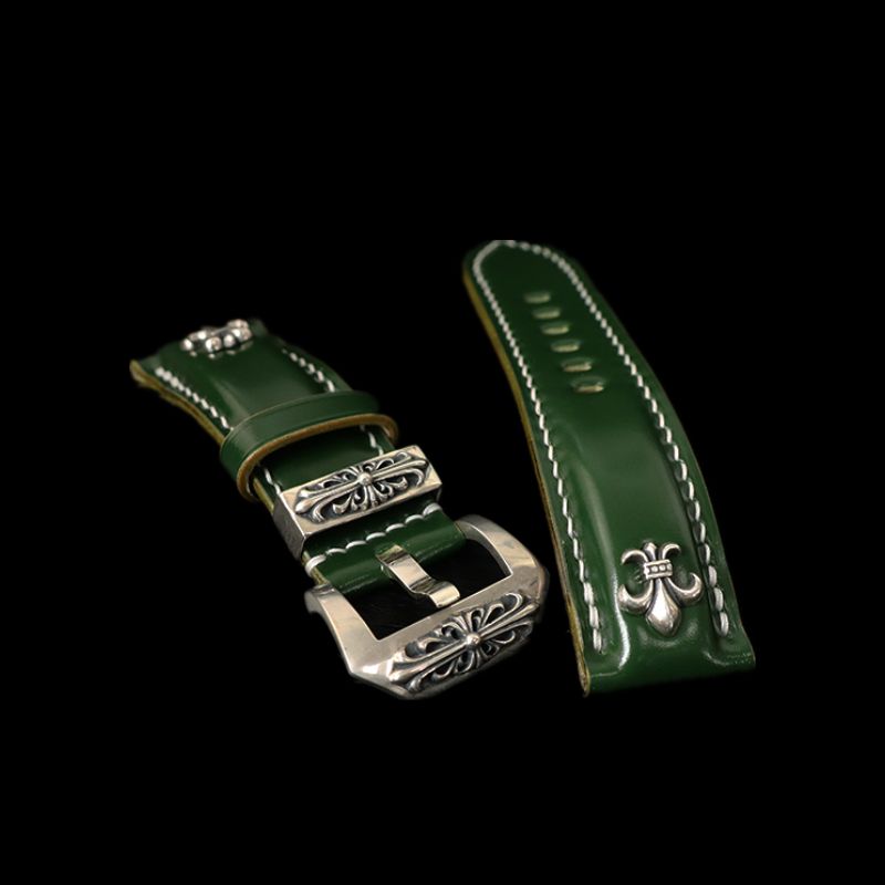 Custom handcrafted watch strap in emerald green Shell Cordovan, designed with Gothic-punk aesthetics and a 925 silver iris centerpiece