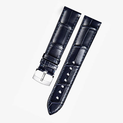 Dark blue alligator-textured leather strap with silver buckle, compatible with Omega Constellation models. Elegant texture and refined craftsmanship by WatchesMate