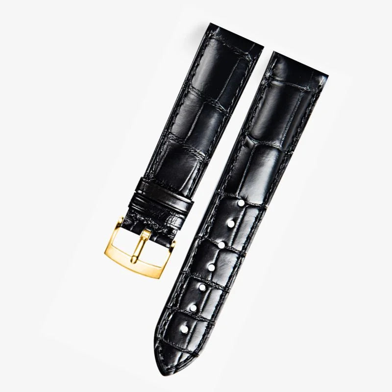 Black alligator-textured leather watch band compatible with Omega dress watches, featuring a polished gold pin buckle for a refined and timeless look