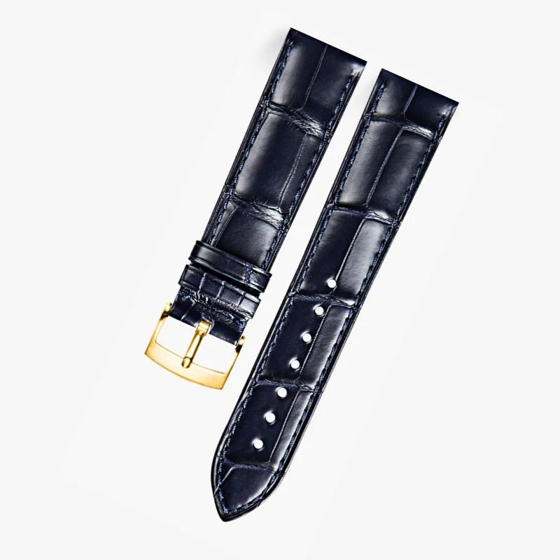 Dark blue alligator-textured leather strap with gold buckle, compatible with Omega watches. A refined choice for luxury watch enthusiasts