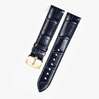 Dark blue alligator-textured leather strap with gold buckle, compatible with Omega watches. A refined choice for luxury watch enthusiasts