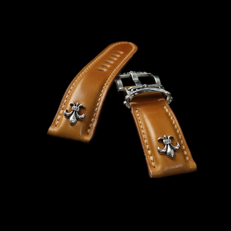 Lustrous orange Shell Cordovan leather detail on watch strap, hand-polished through dozens of processes for a time-tempered finish