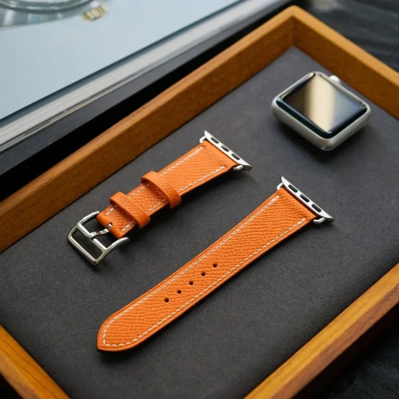 WatchesMate handcrafted vibrant orange Epsom leather watch strap, compatible with Apple Watch Ultra and Series 10.
